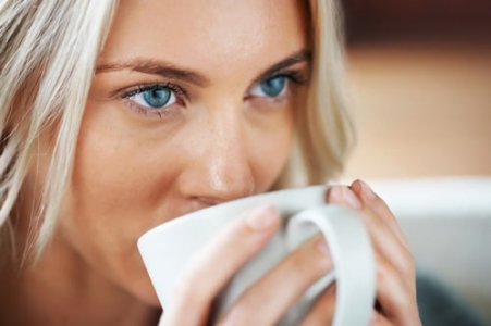 blue-eyed-woman-drinking-coffee.jpg