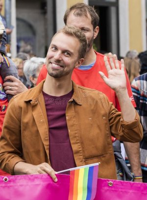 handsome-smiling-man-waving-camera-gay-pride-parade-also-known-as-christopher-street-day-csd-mun.jpg