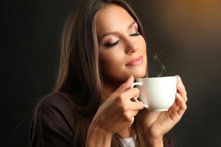bigstock-beautiful-young-woman-with-cup-38907037.jpg