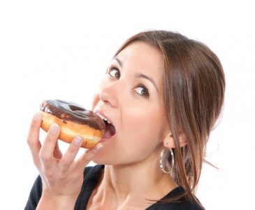 Woman_eating_donut.jpg Woman_eating_donut.jpg